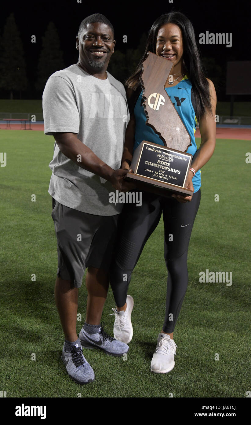 Long Beach Poly Jackrabbits sprints coach Doc Moye (left) and Ariyonna ...