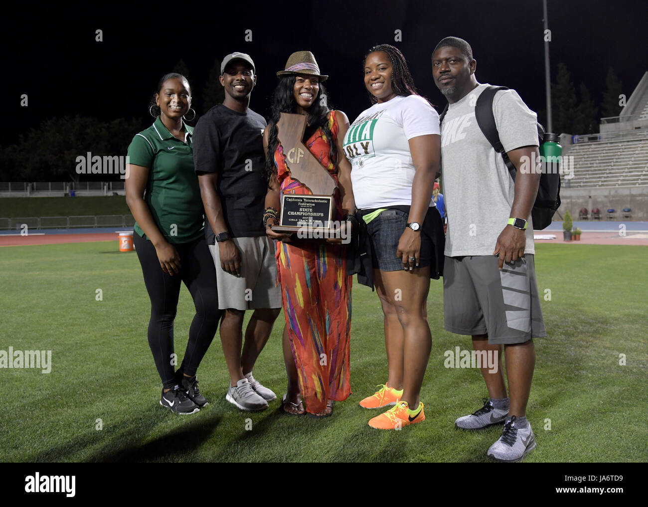 Members of the Long Beach Poly Jackrabbits coach Cryrstal Irving and ...