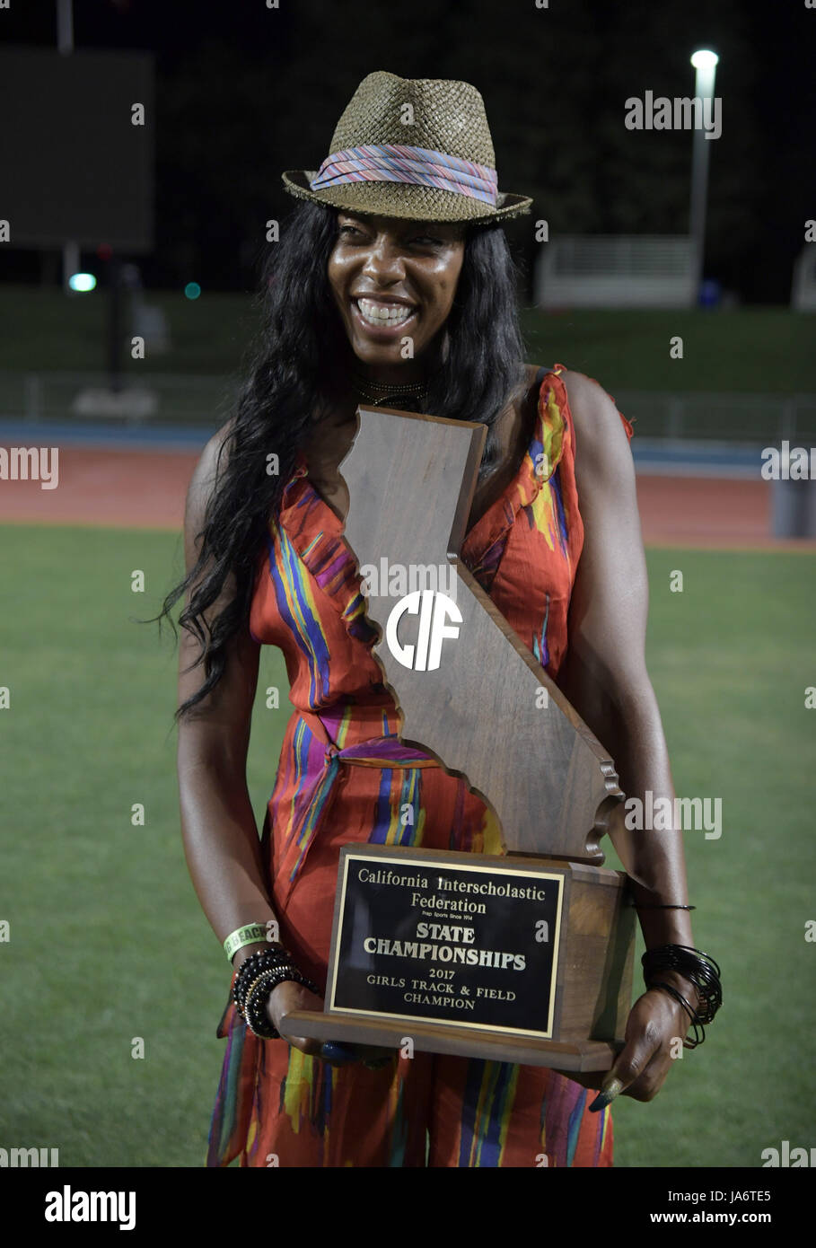 Long Beach Poly Jackrabbits coach Crystal Irving poses with the girls ...