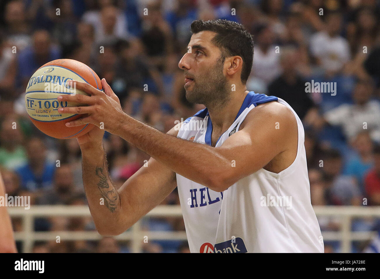 Athens, Greece. 23rd Aug, 2017. Greece's Yannis Bourousis, center, at the Acropolis basketball tournament at the indoor Olympic stadium of Athens Georgia beats Greece 72-71 during the group stage match of the Acropolis International Basketball Tournament. Credit: SOPA Images Limited/Alamy Live News Stock Photo