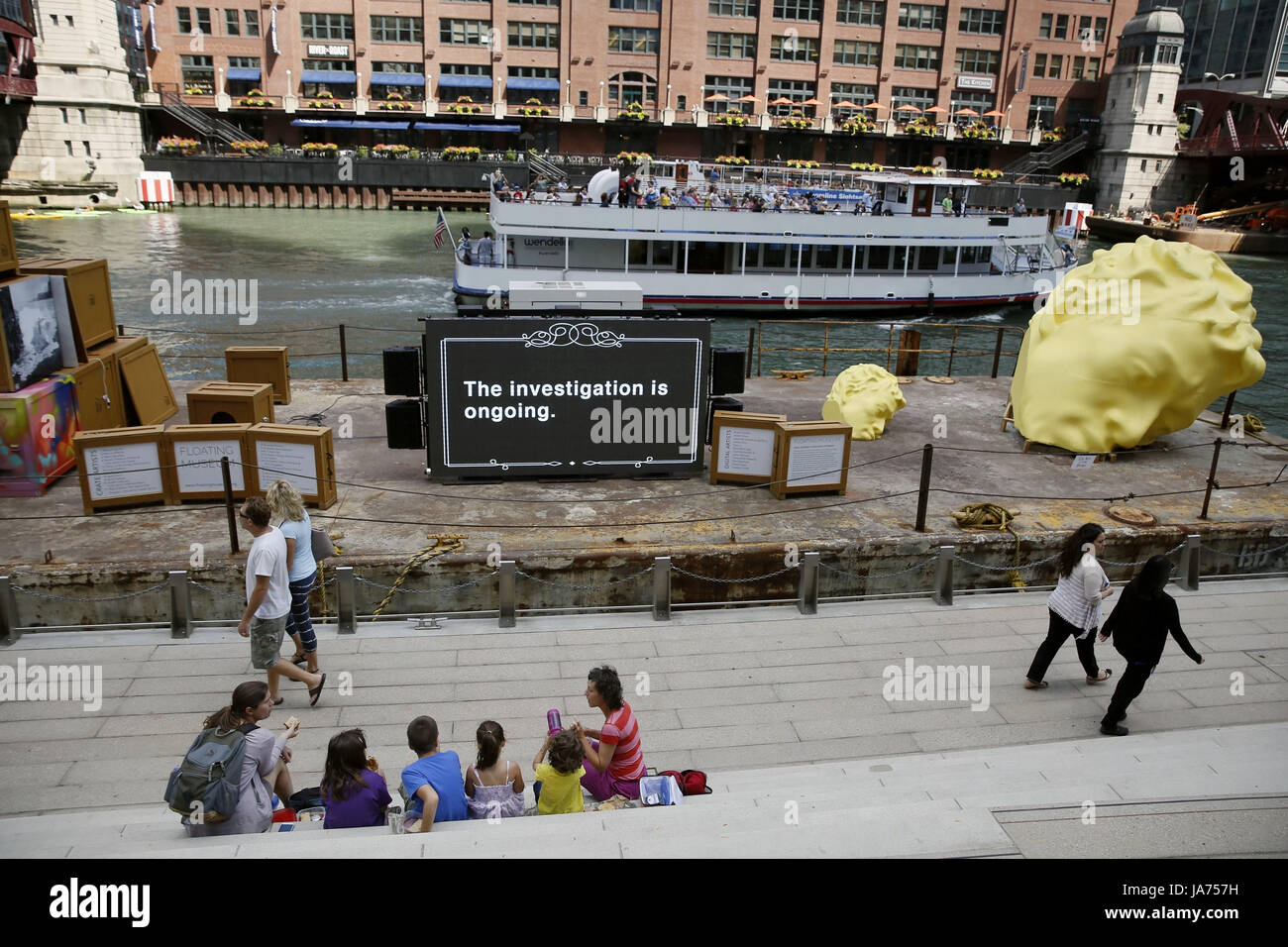 (170824) -- CHICAGO, Aug. 24, 2017 (Xinhua) -- Photo taken on Aug. 23, 2017 shows Floating Museum docked at the riverside in Chicago, the United States. Celebrating the River's industrial past, Floating Museum transforms a barge into an aesthetically striking mobile gallery filled with art crates displaying work created by local artists and our collaborators. Floating Museum exists in the continuum of artists examining their relationship to institutions, and responds to the evolution of museums; ranging from the cabinet of curiosities or Wunderkabinett between the sixteenth and eighteenth cent Stock Photo