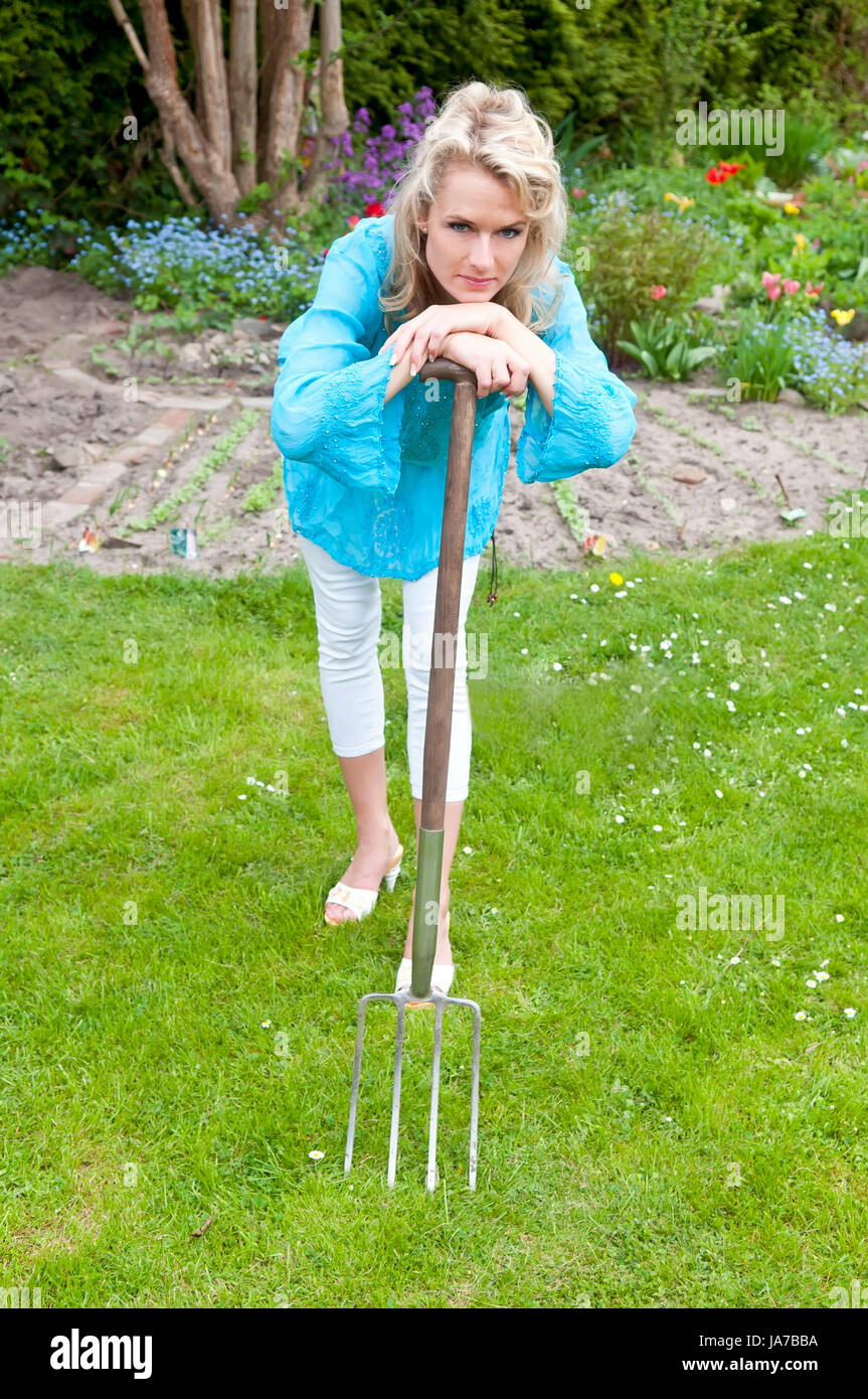 blonde with pitchfork Stock Photo Alamy