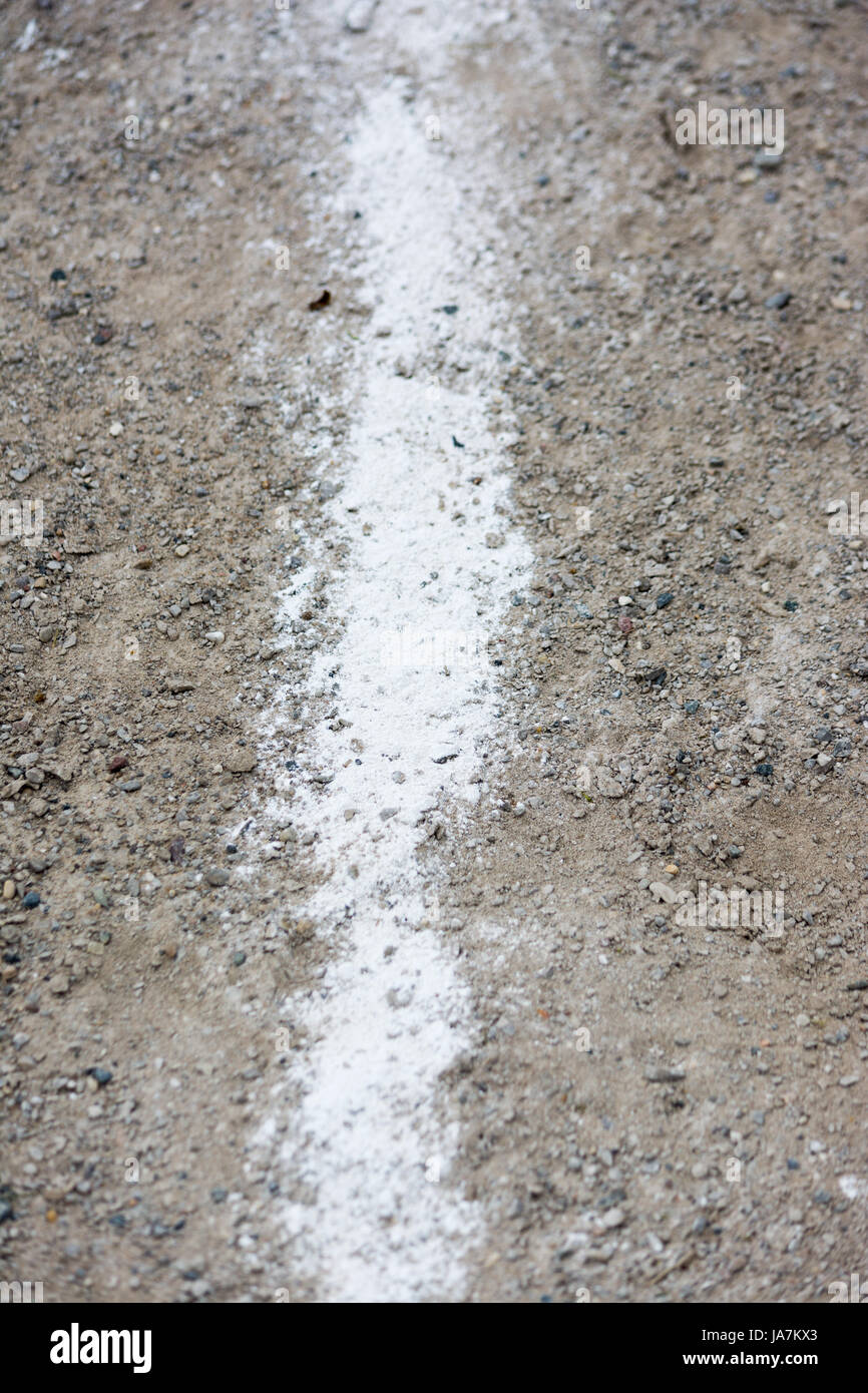 chalk line in gravel for sporting event Stock Photo Alamy