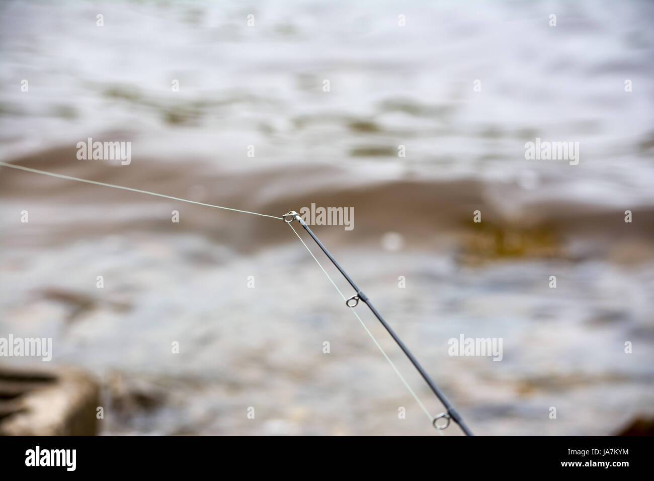 fishing pole tip with line waiting for the bite Stock Photo - Alamy