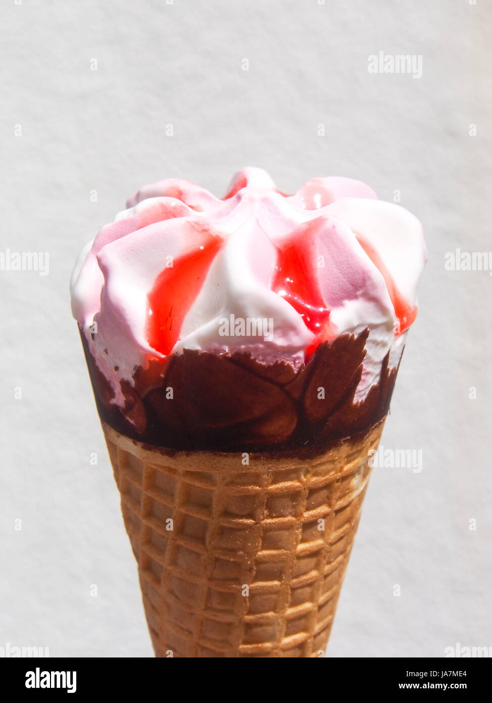 A strawberry and vanilla ice cream cone Stock Photo