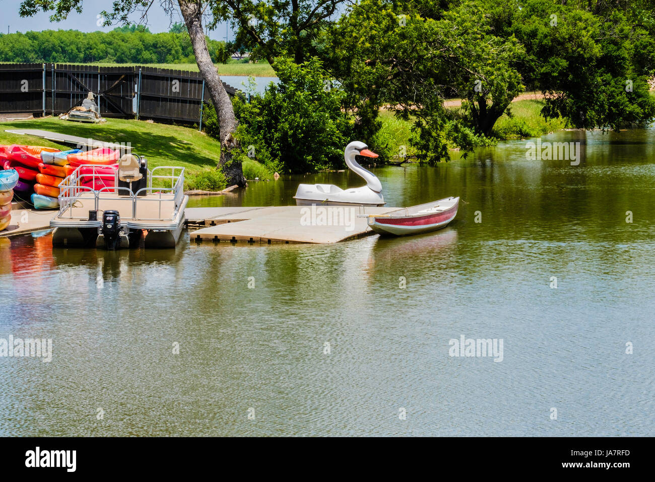 Recreational boat rentals around a dock on the North Canadian river near Oklahoma City, Oklahoma, USA. Stock Photo