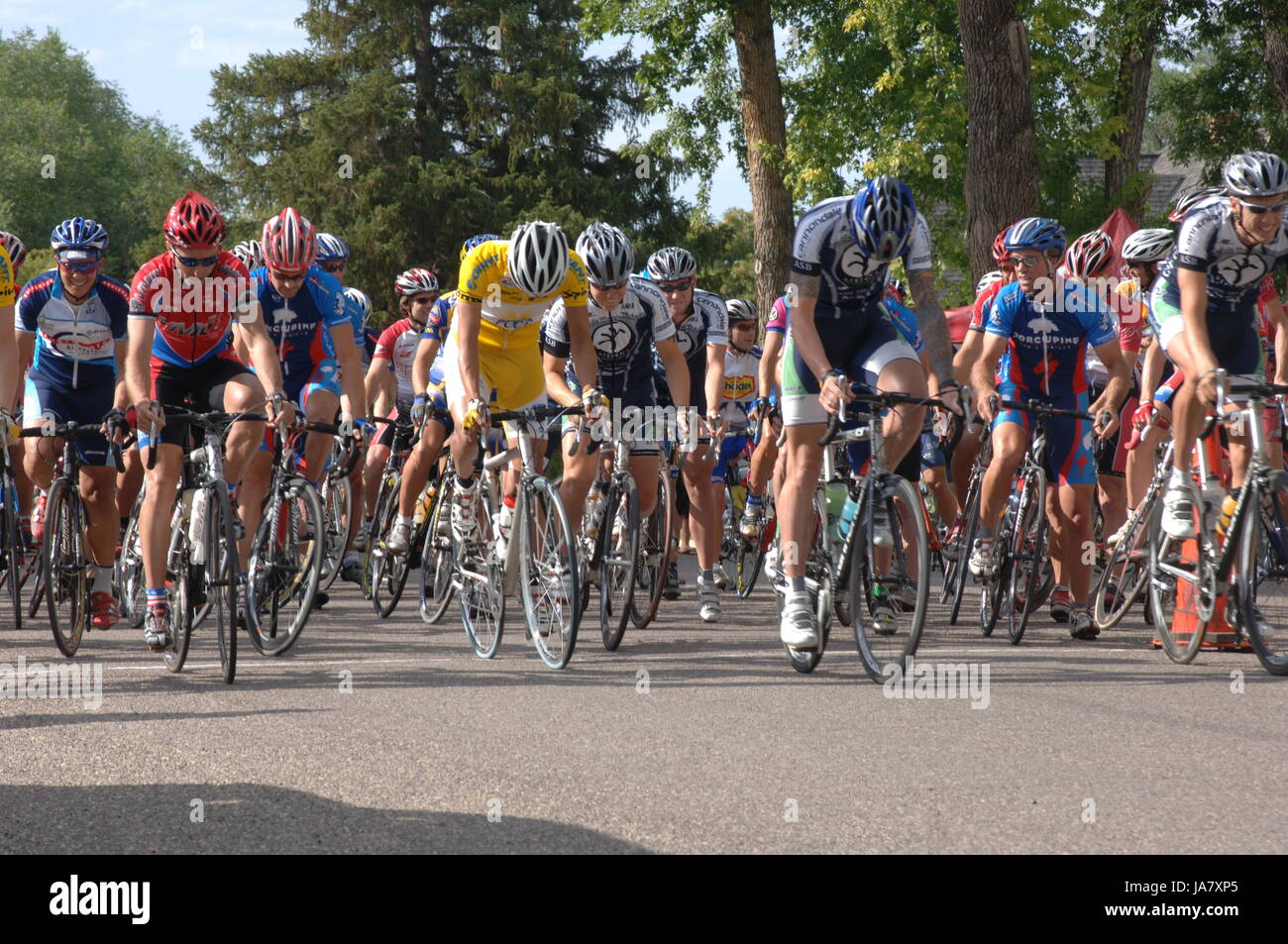 Spring City, Utah, USA - 2 August 2006: Group of cyclists riding down Main Street in the Sanpete Classic Road Race in Sanpete County Utah, start of th Stock Photo