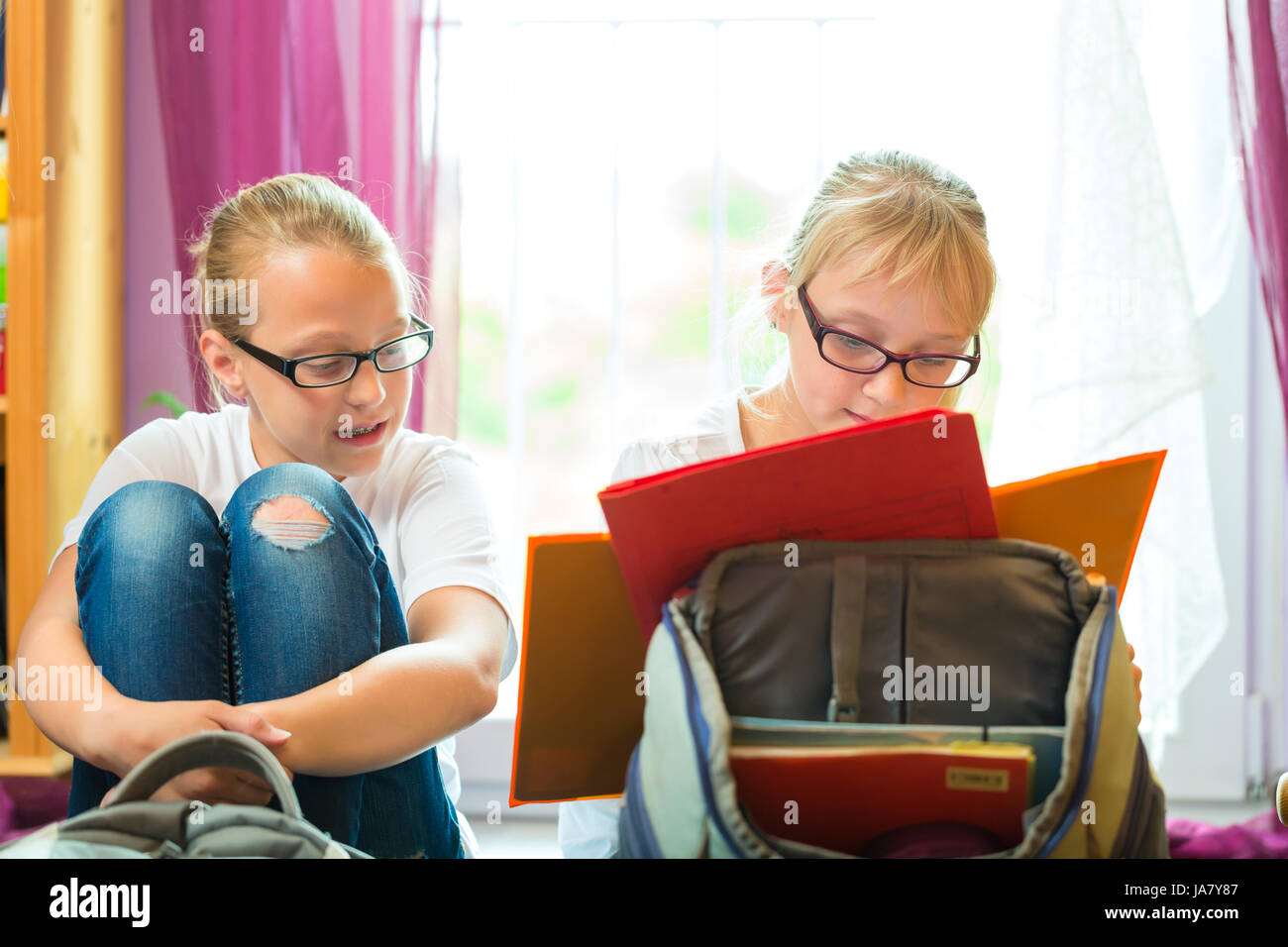 girl with homework Stock Photo