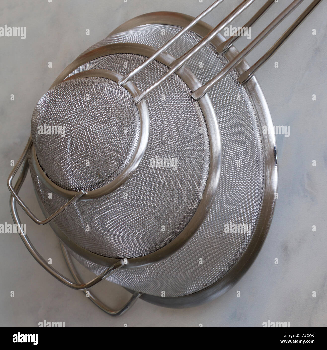 Three metal kitchen sieves Stock Photo Alamy