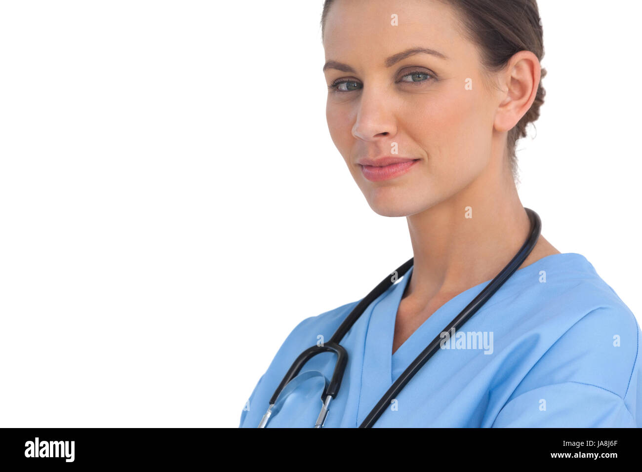 Surgeon smiling at camera on white background Stock Photo - Alamy
