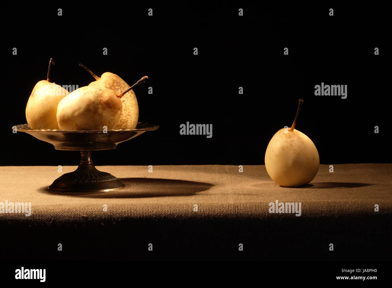 Vintage brass fruit bowl with pears on canvas surface Stock Photo Alamy