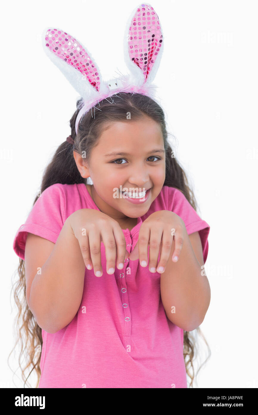Little girl does an imitation of rabbit on white background Stock Photo ...