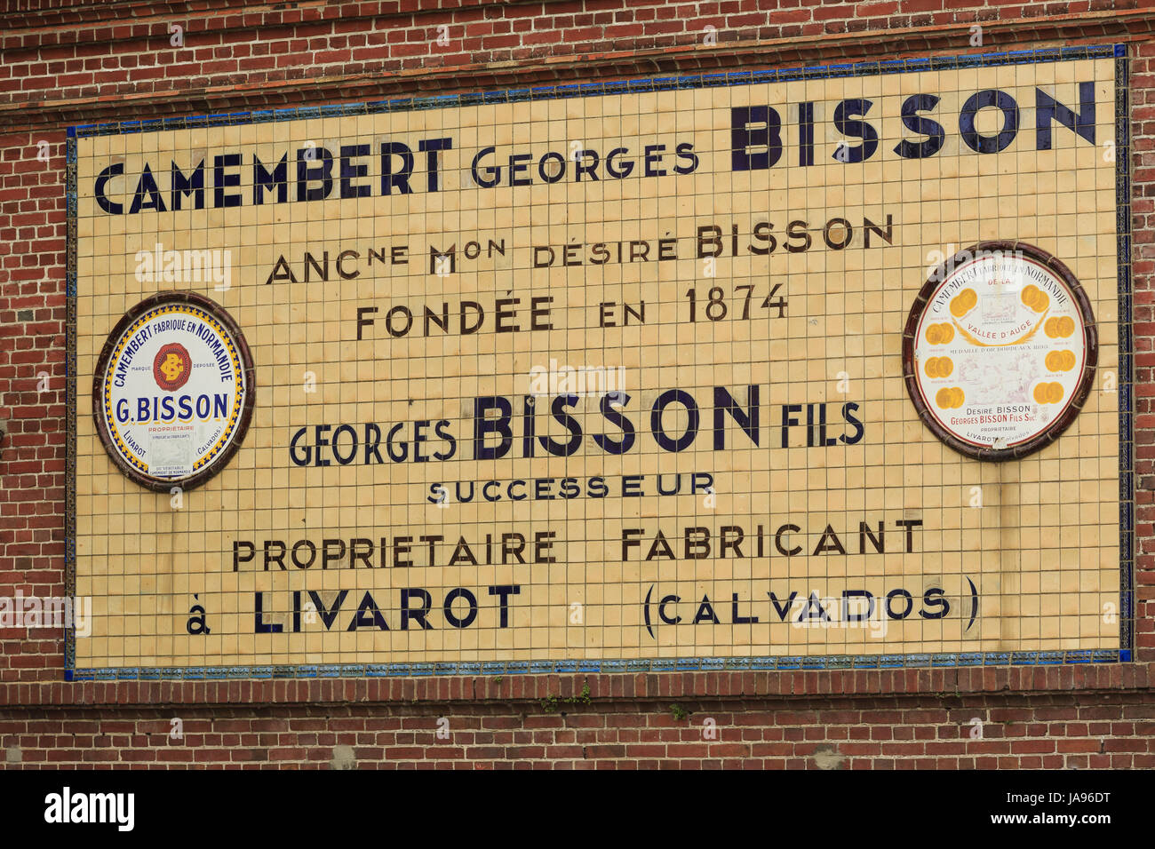 France, Calvados, Livarot, old sign of the company Bisson manufacturer of camembert Stock Photo
