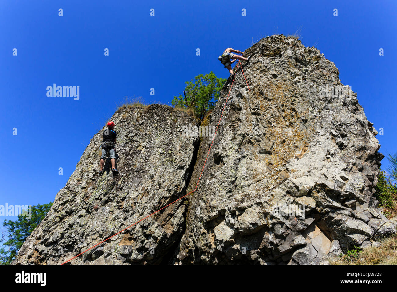 France, Cantal, Carlat, climbing on the Carlat Rock Stock Photo