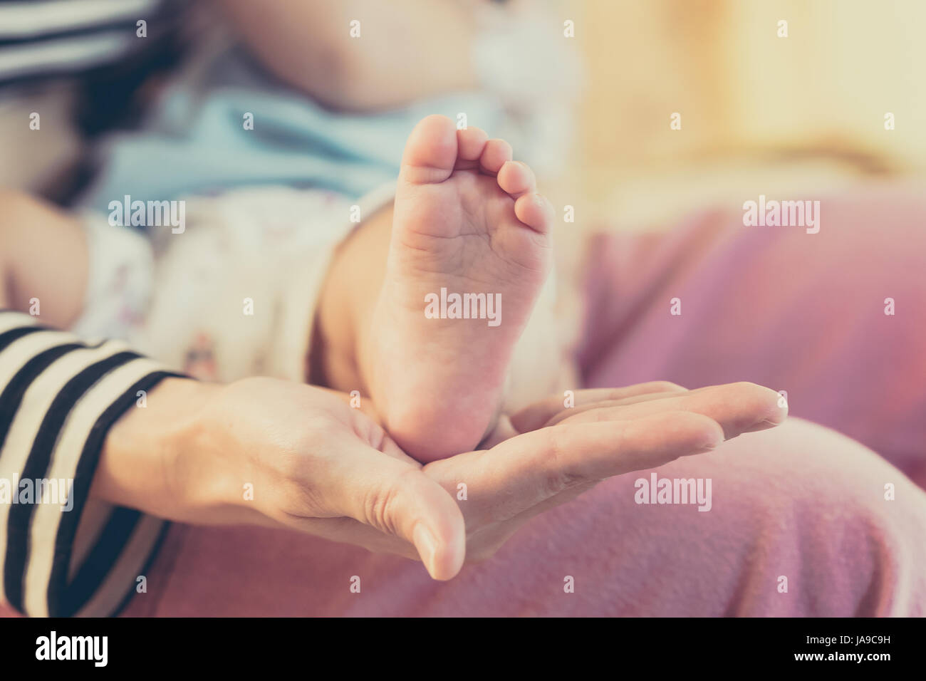 Foot feet hand hold holding caucasian hires stock photography and