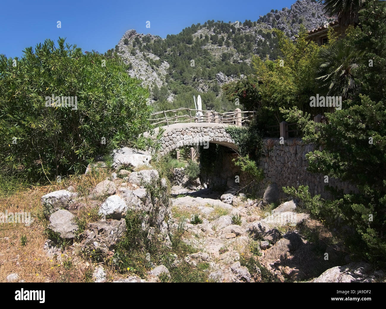Walking path bridge landscape view in Tramuntana mountains between Soller and Cala Tuent, Mallorca, Spain. Stock Photo