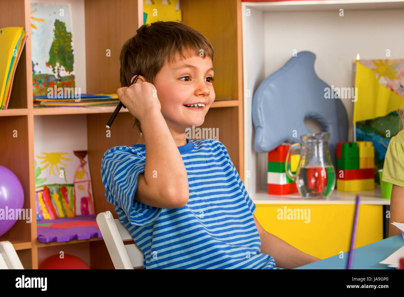 Small students boy painting in art school class Stock Photo - Alamy