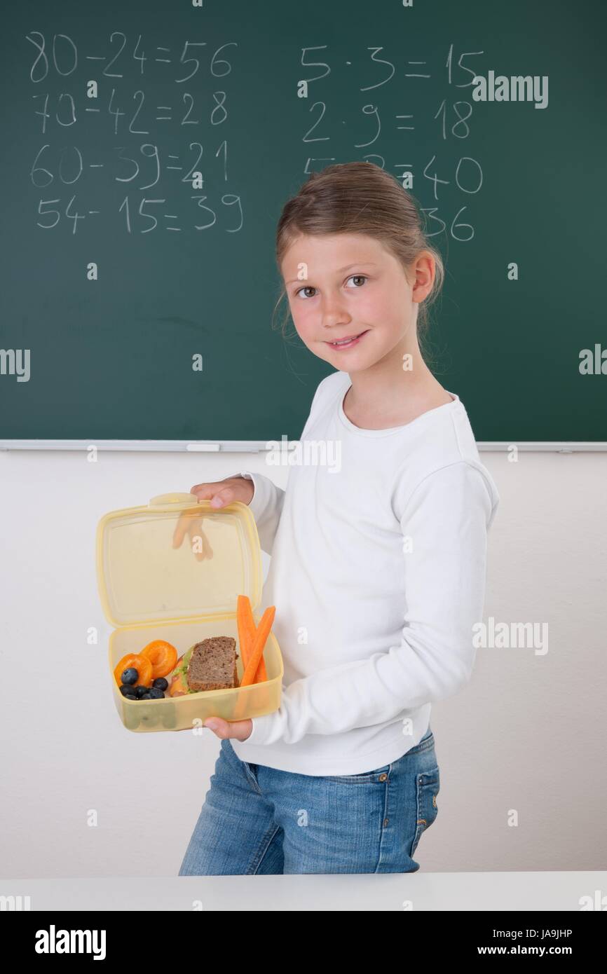 schoolgirl with lunch box Stock Photo