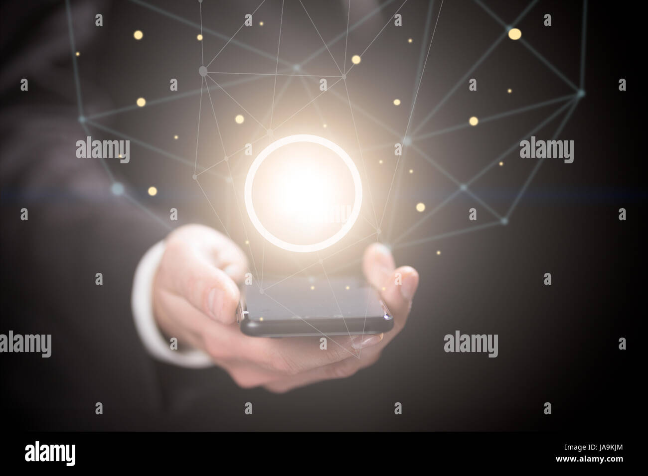 Businessman holding crystal yellow ball Stock Photo - Alamy