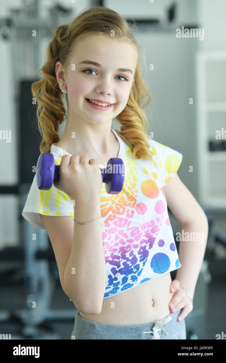 Cute little girl doing exercises Stock Photo - Alamy