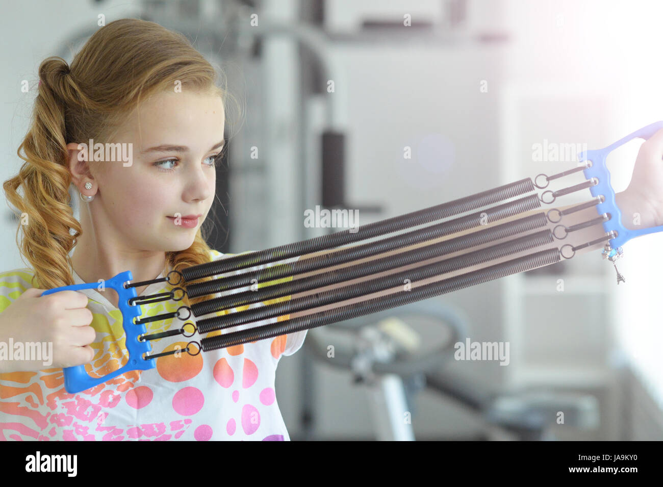 Cute little girl doing exercises Stock Photo - Alamy