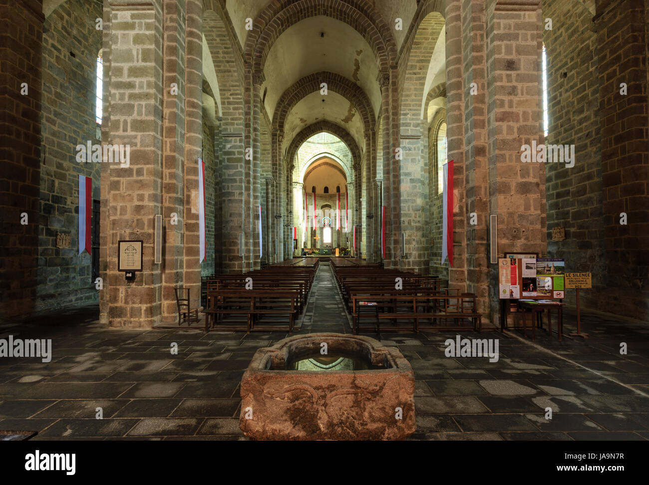 France, Haute Vienne, le Dorat, Saint Pierre du Dorat church, the nave and the Carolingian baptismal font Stock Photo