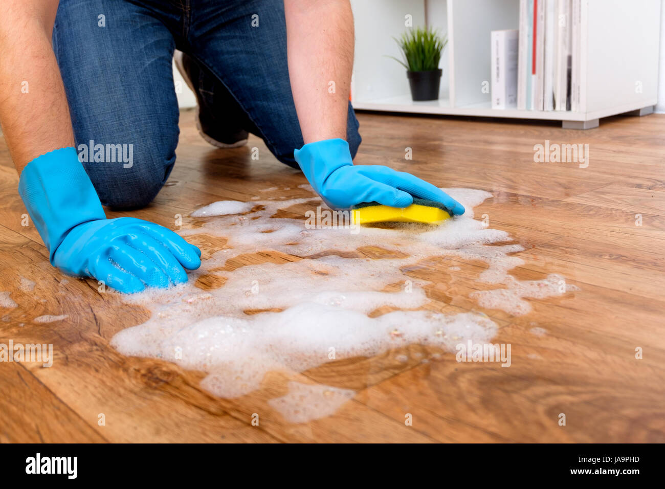 Cleaning a parquet floor with foam on the floor Stock Photo Alamy