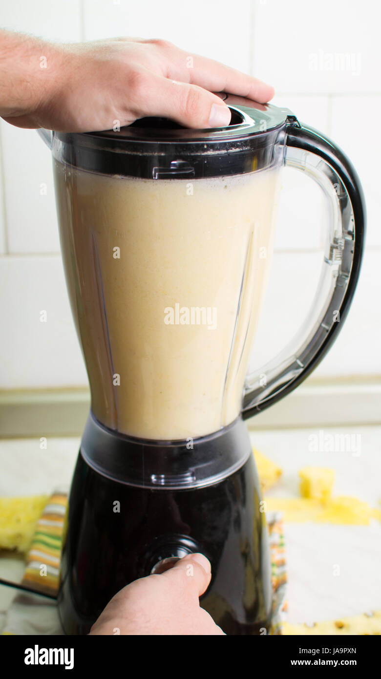 Using blender for making a healthy smoothie Stock Photo Alamy
