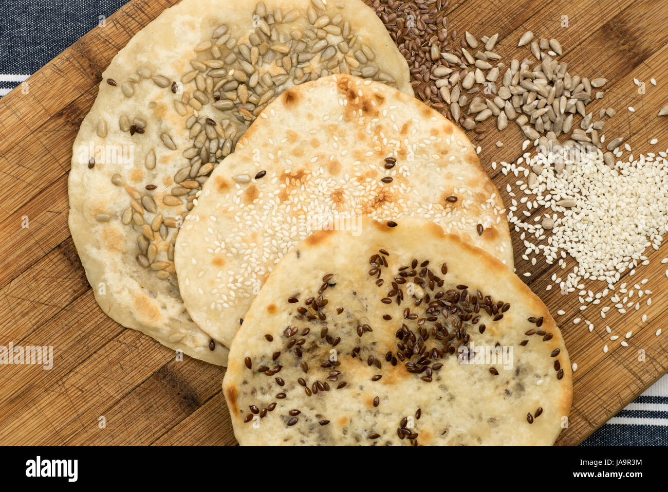 small flat bread with seeds Stock Photo Alamy