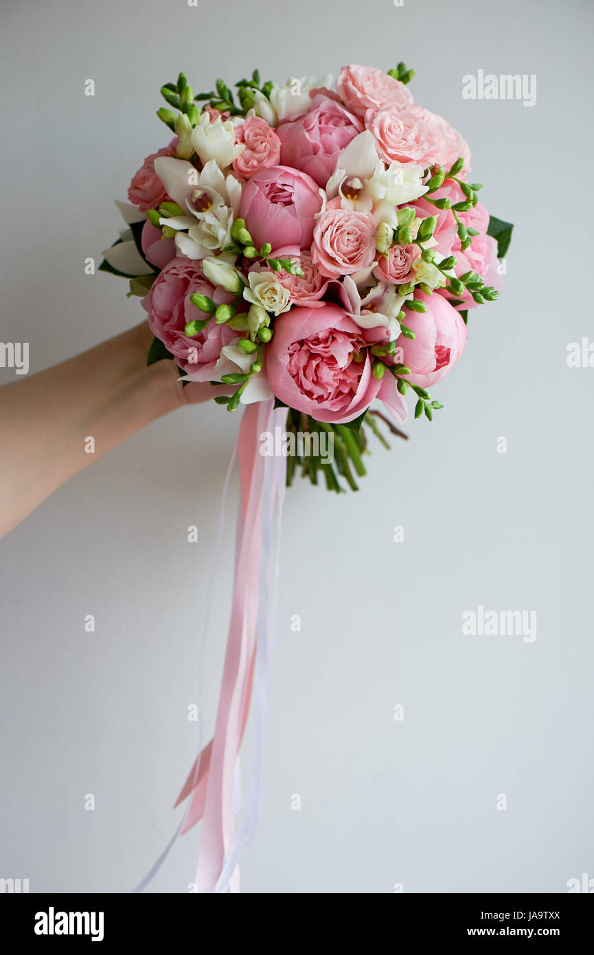 The bride's bouquet of soft pink peonies and white roses . Wedding  floristry.Classic form Stock Photo - Alamy