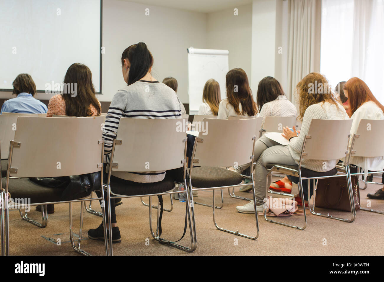 Women student during study, in lecture Audience Stock Photo