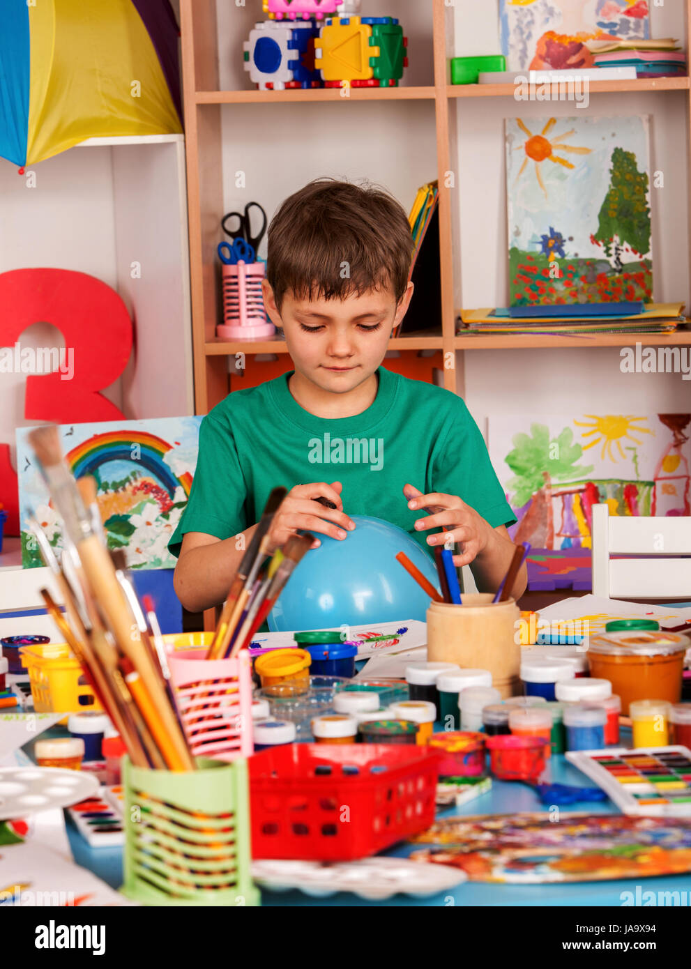 Small students boy painting in art school class Stock Photo - Alamy