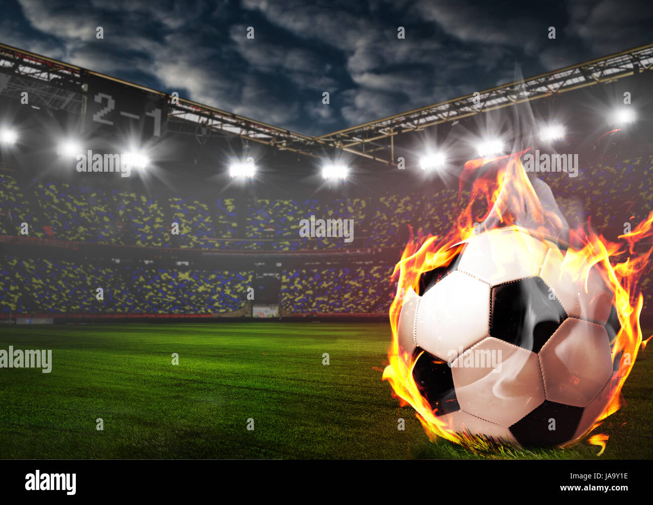 Burning soccer ball on stadium Stock Photo Alamy