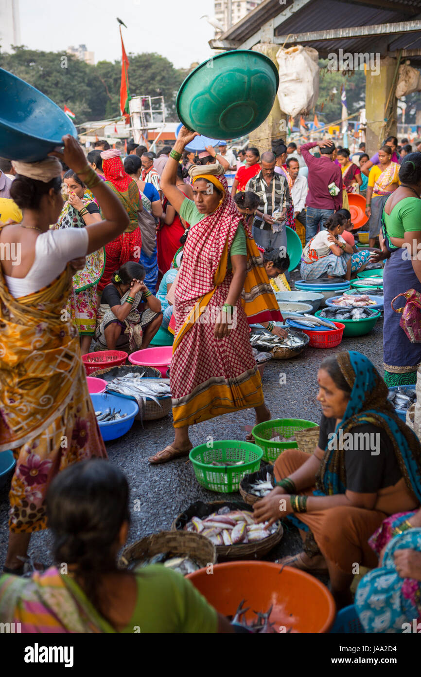 Women buying and selling fresh fish at Sassoon fish market, Mumbai