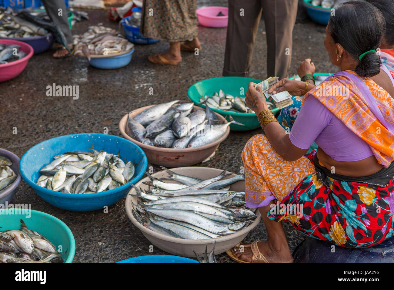 Fishermen selling fish market from boat hires stock photography and