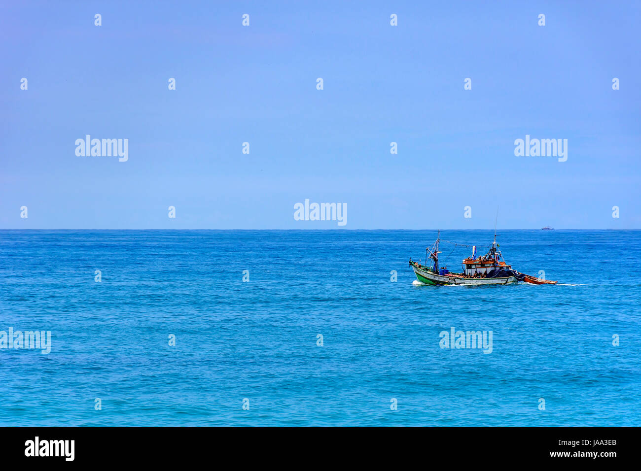 Fishing boat sailing in the waters of the Rio de Janeiro sea Stock Photo