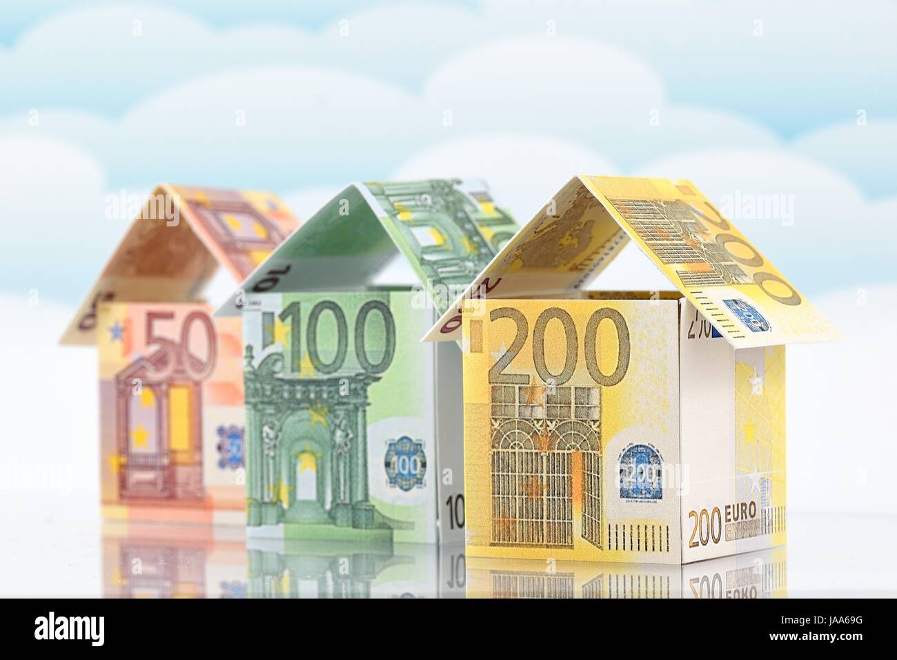 Housing market, a prosperous future. Material: banknotes (euros). Form: houses Stock Photo