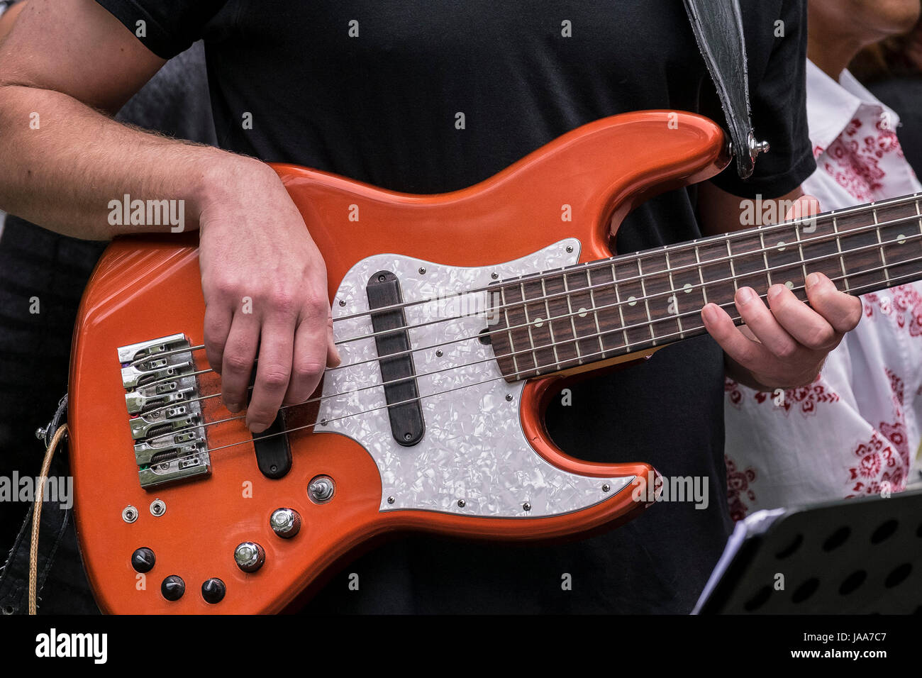 A bass guitarist performing Stock Photo Alamy