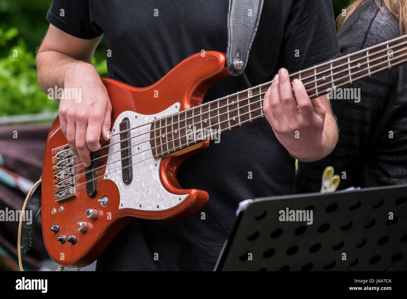 A bass guitarist performing Stock Photo Alamy