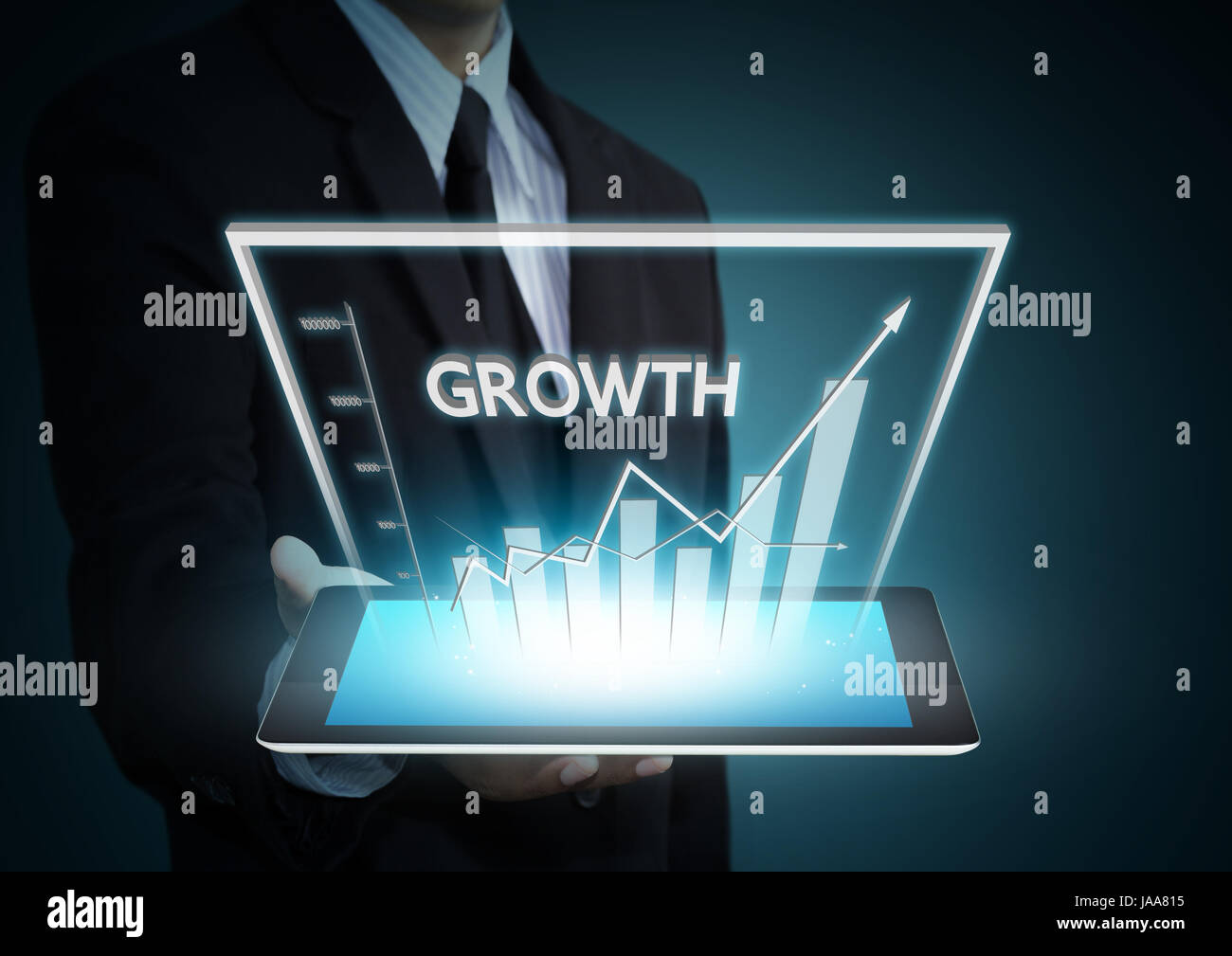 Business hand holding growth graph on tablet technology Stock Photo - Alamy