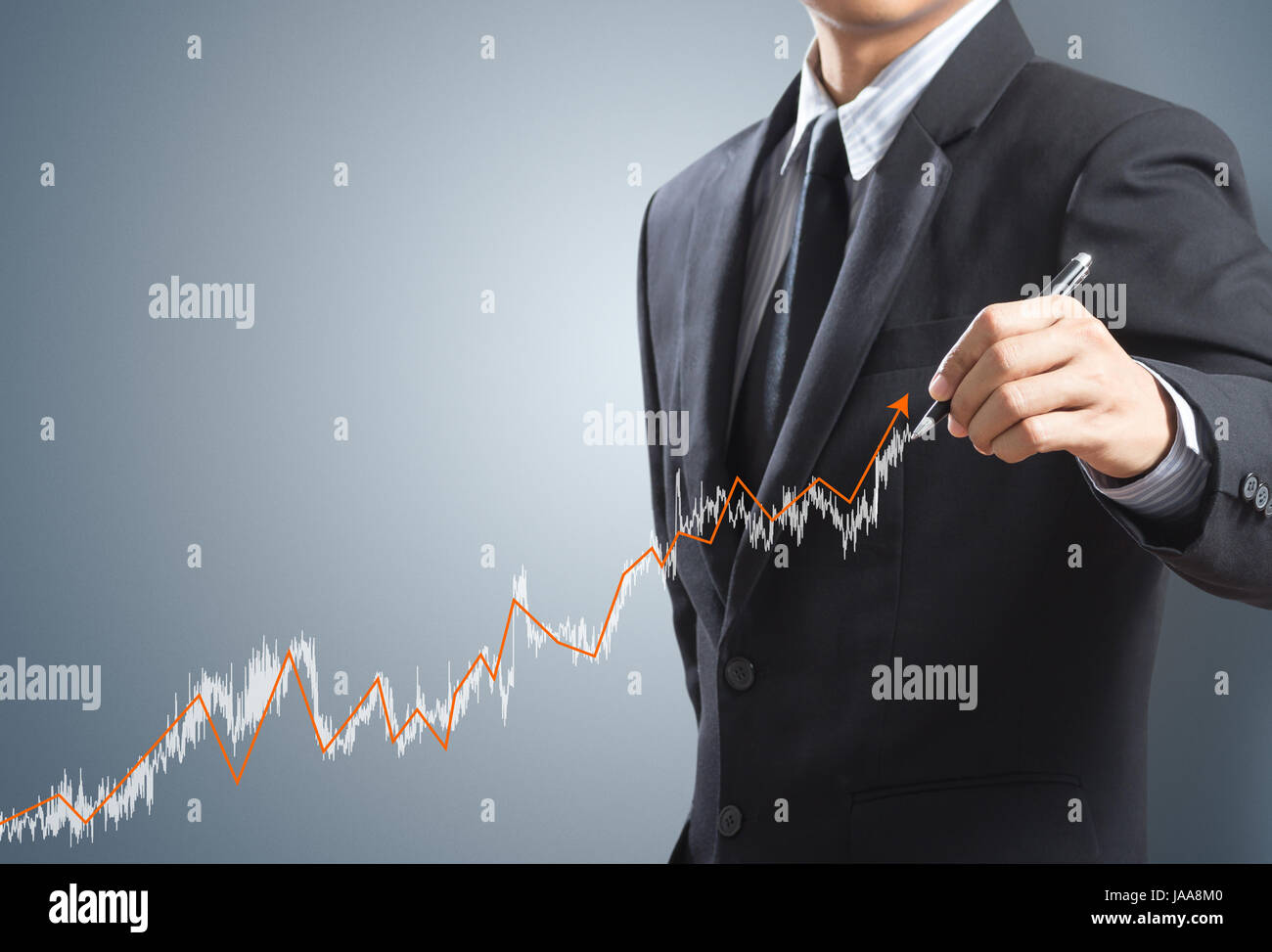 Business man drawing a growing graph concept Stock Photo - Alamy