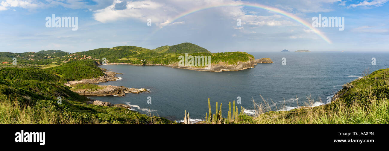 Rainbow over Forno beach in Buzios, north coast of Rio de Janeiro, Brazil Stock Photo