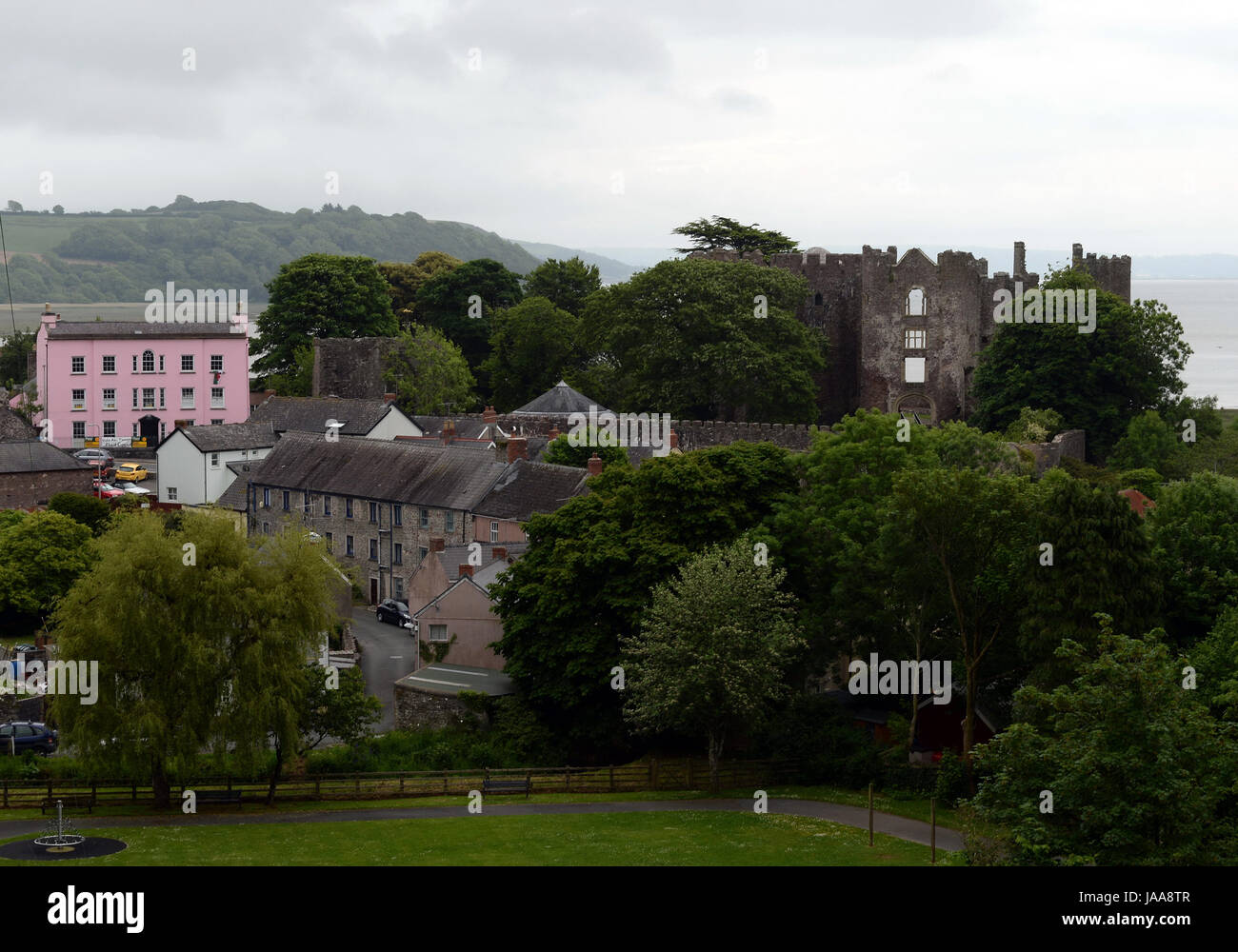 Laugharne home of Dylan Thomas surrounded by wooded valleys and overlooking the river Taf Stock Photo