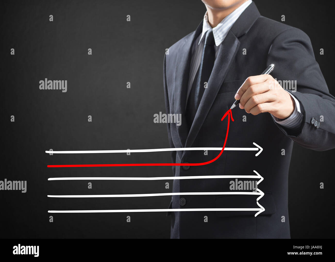 Businessman drawing arrows in different directions Stock Photo - Alamy