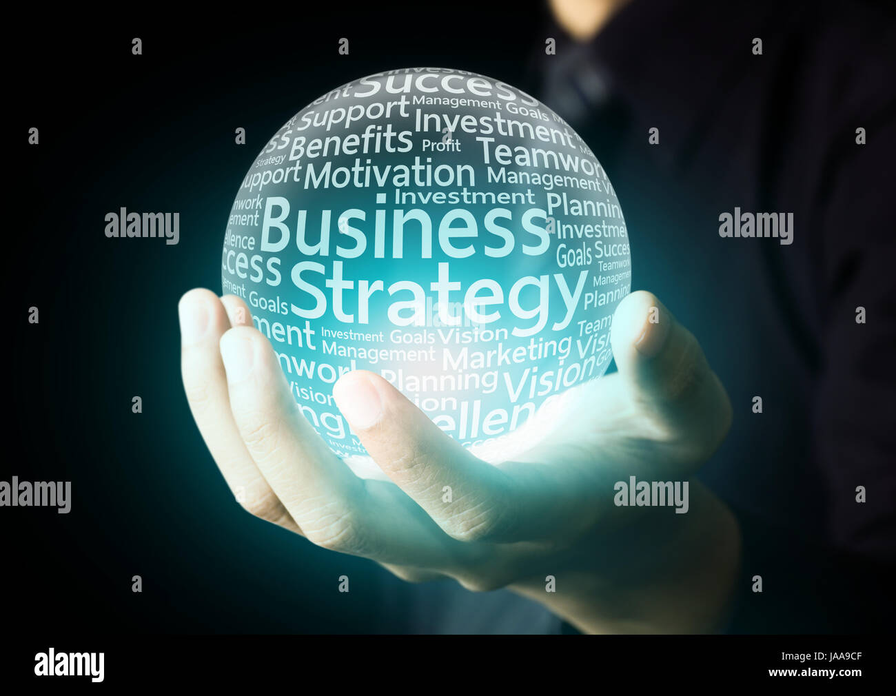 Businessman hand showing business strategy word in crystal ball Stock Photo