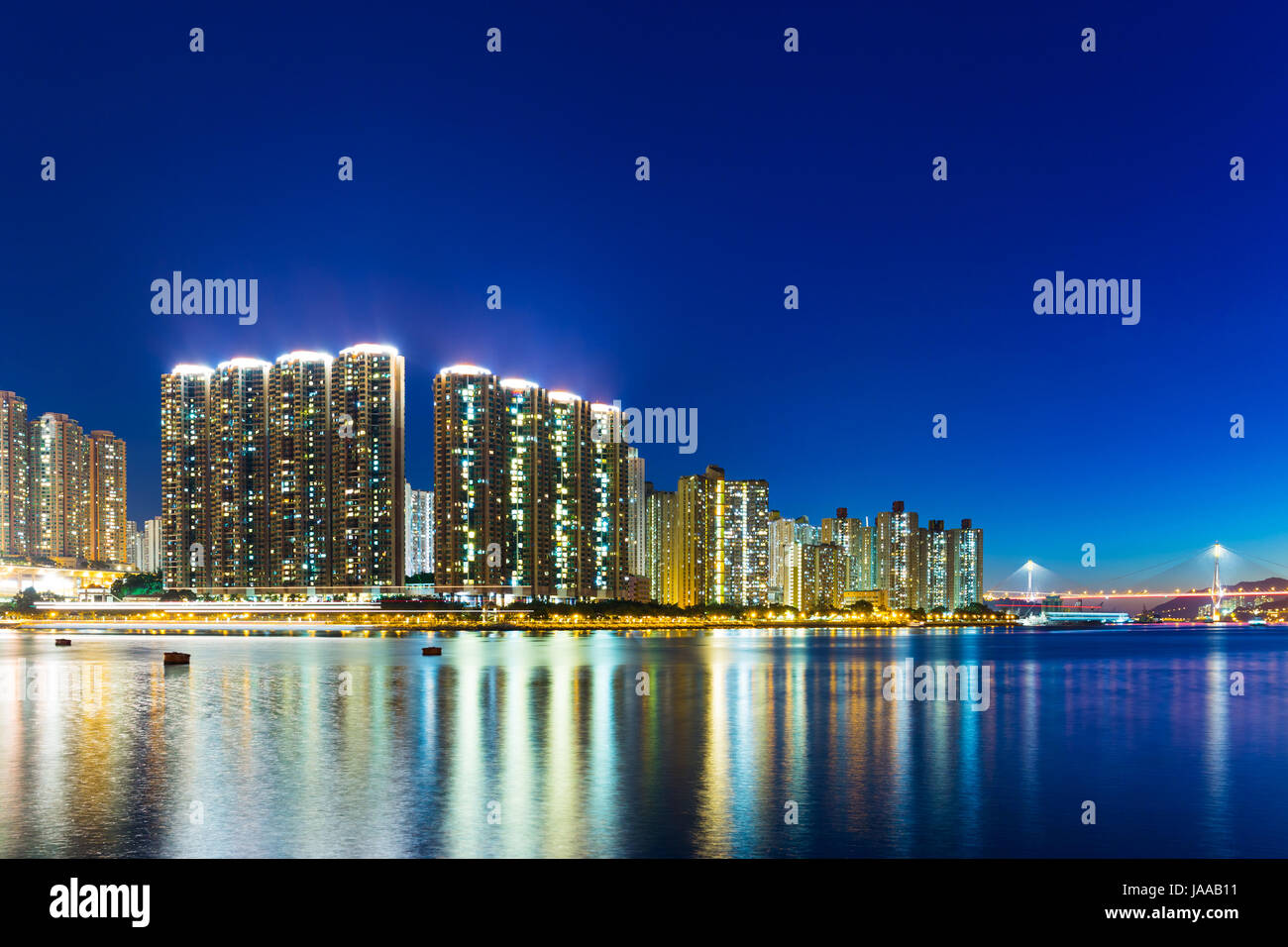 Apartment building in Hong Kong at night Stock Photo - Alamy