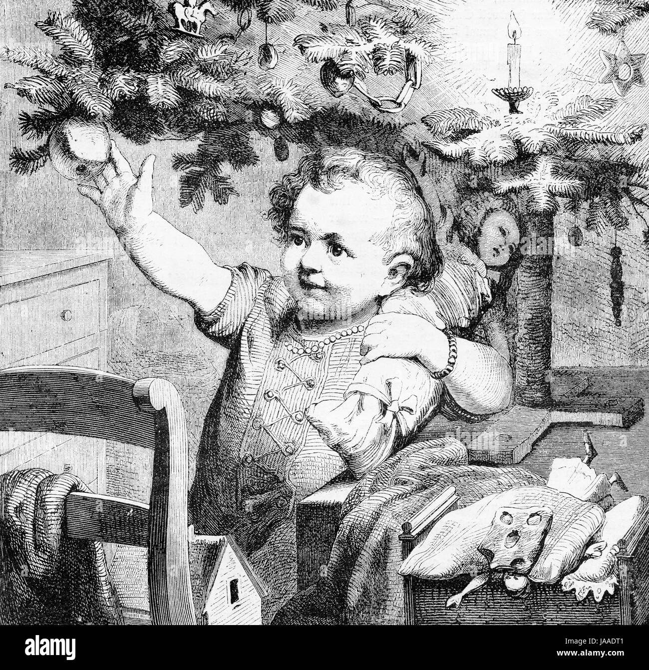 Toddler happy under the Christmas tree - engraving from XIX century Stock Photo