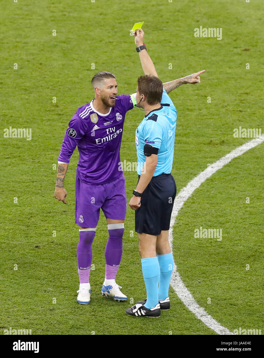 Real Madrid's Sergio Ramos is shown the yellow card by referee Felix