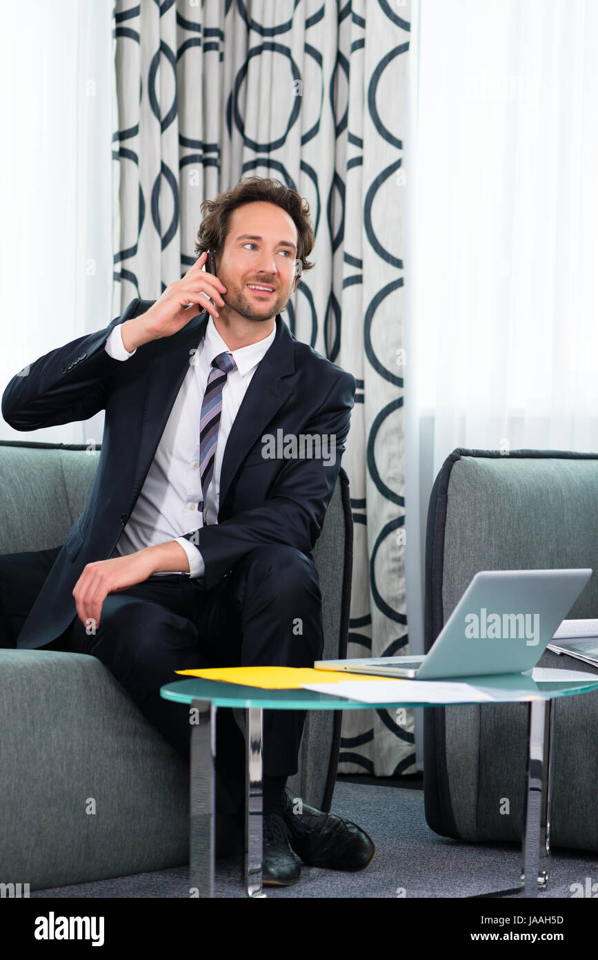 business person in the hotel phone with a customer Stock Photo