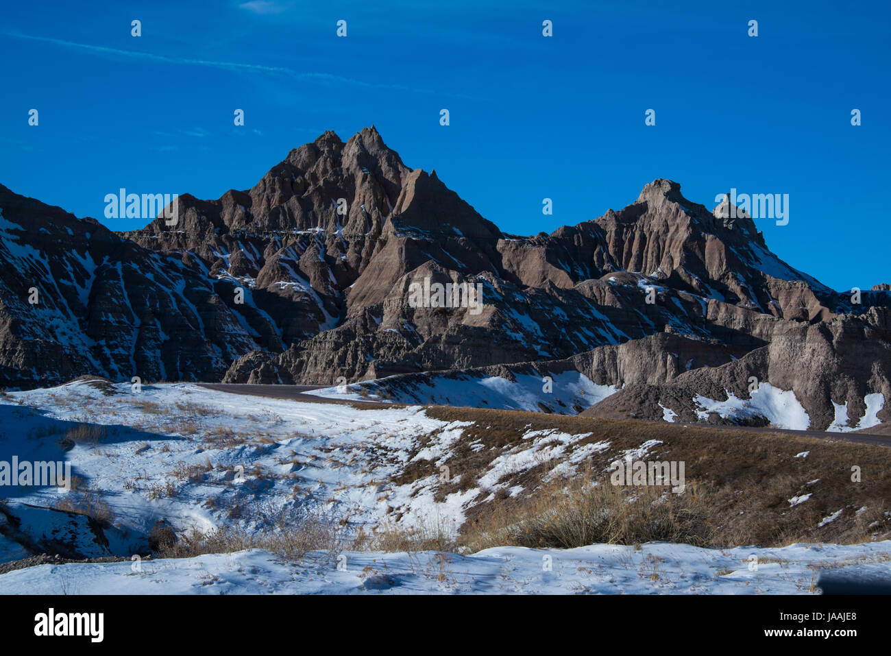 The Badlands have a barren moonscape look in the vast open prairie of South Dakota Stock Photo